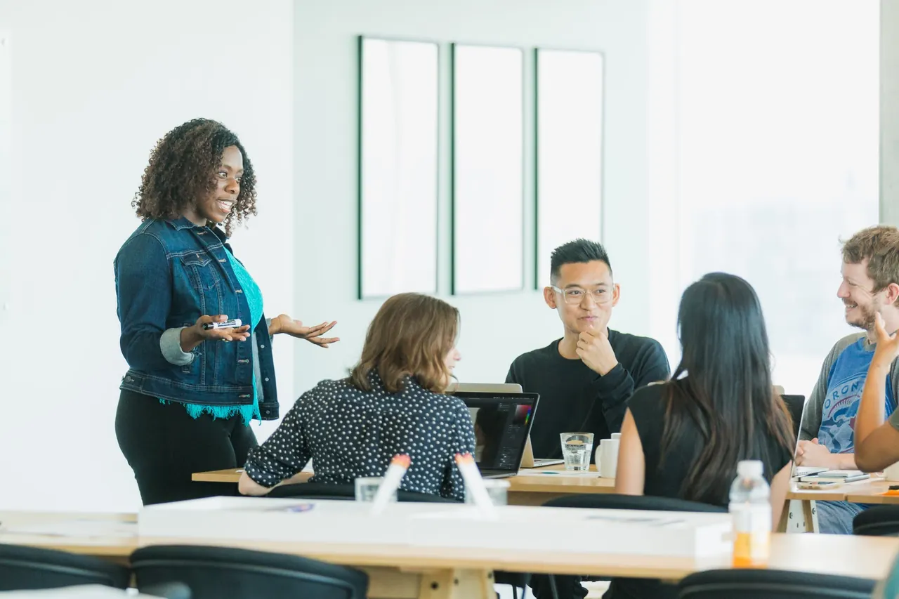 A team discussing plans in a bright office meeting room